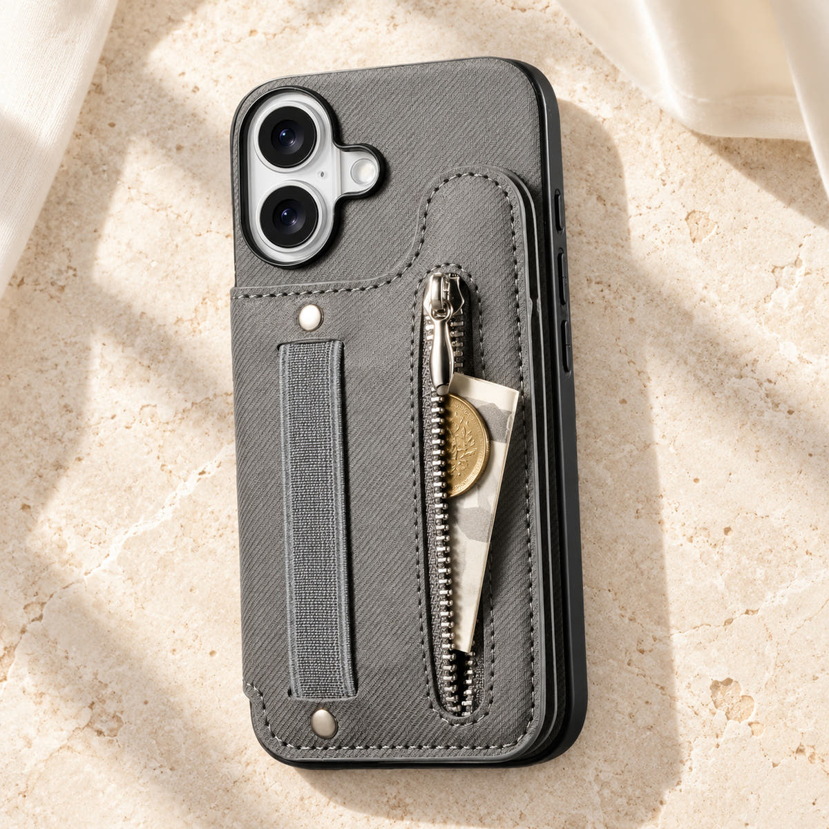 Multi-Pocket iPhone wallet case in Gray on cream limestone with its rear zip pocket open