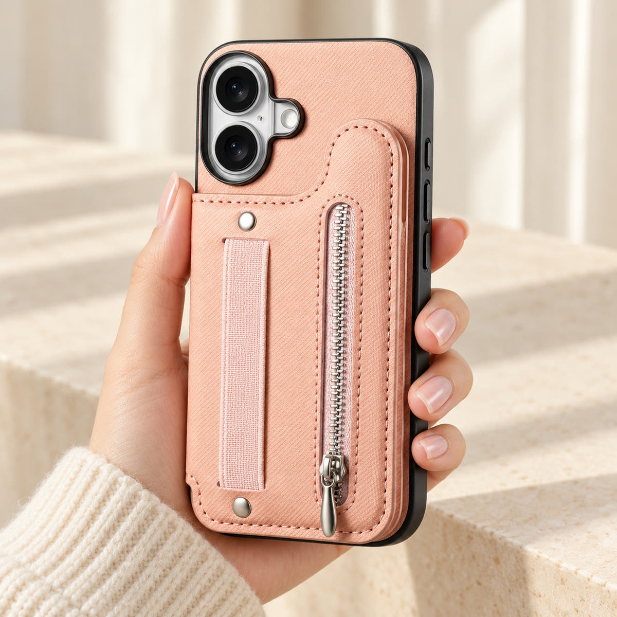 Multi-Pocket iPhone wallet case in Pink held upright, showing the rear wallet, fabric hand strap and silver zip