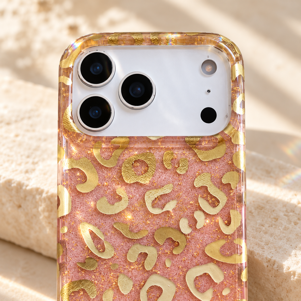 Close-up of the Golden Blush Leopard case's wide camera opening and gold-patterned clear rim.