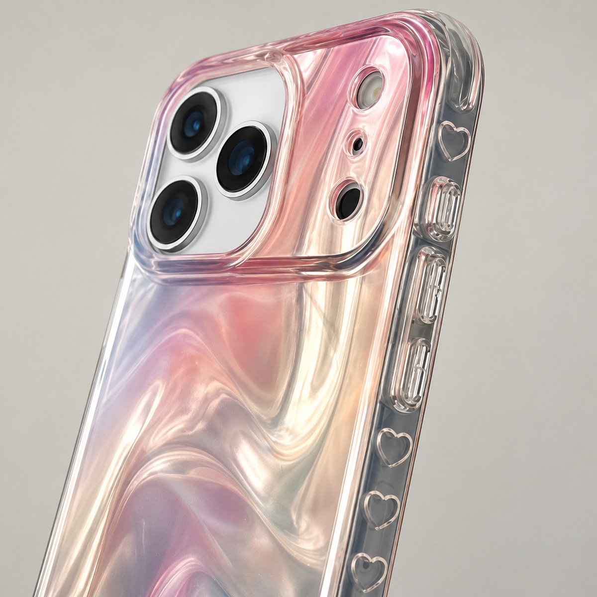 Close-up of the outlined heart motifs and button covers along the Iridescent Rose case’s clear side.
