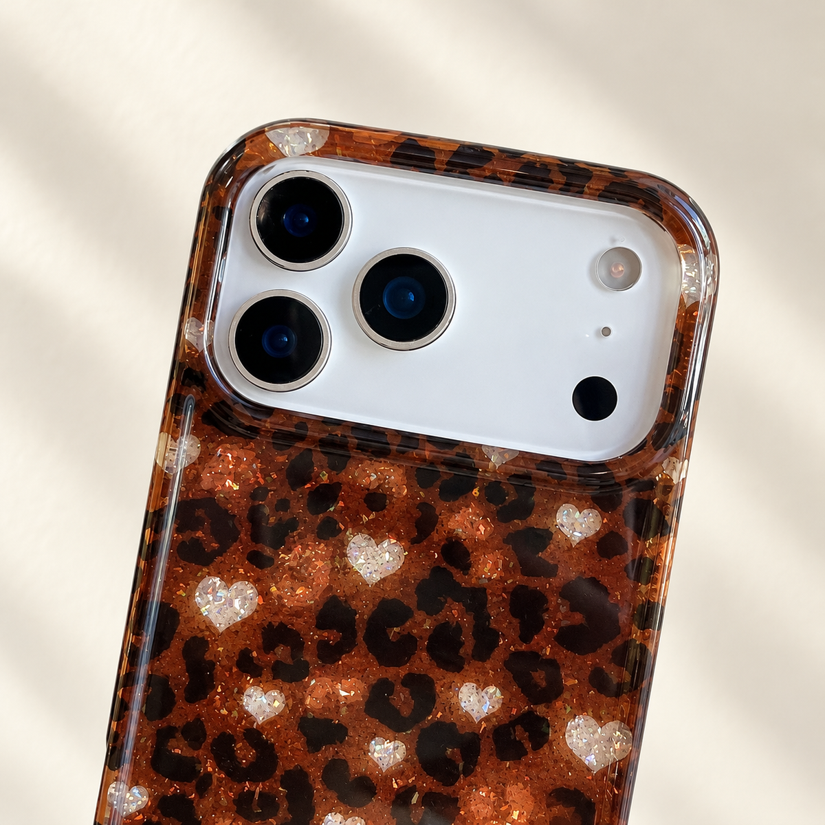 Close-up of the Amber Leopard Heart case’s broad camera opening and coordinated printed rim.