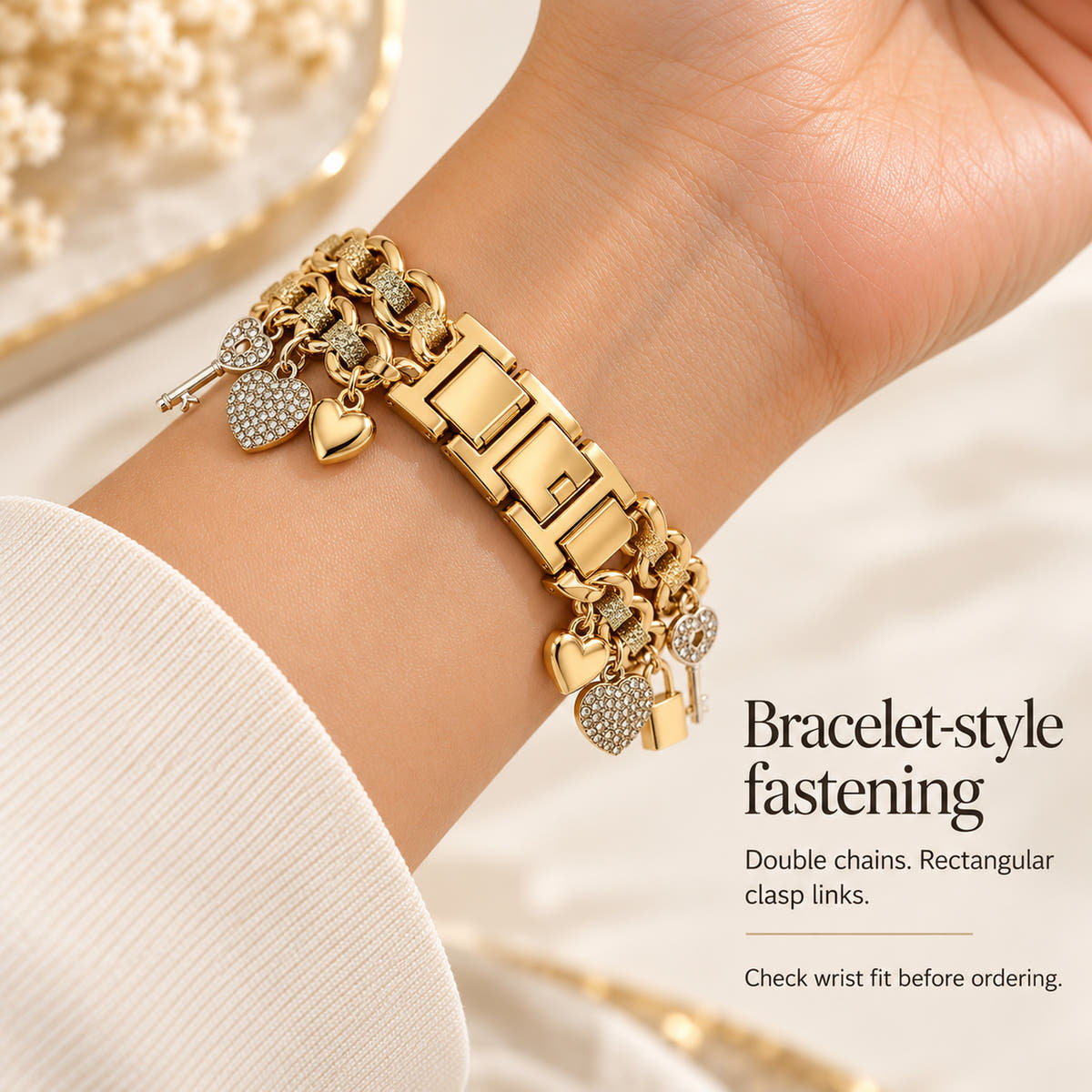 Oskar Hill Amorette Apple Watch charm band — underside of a feminine wrist showing rectangular clasp links