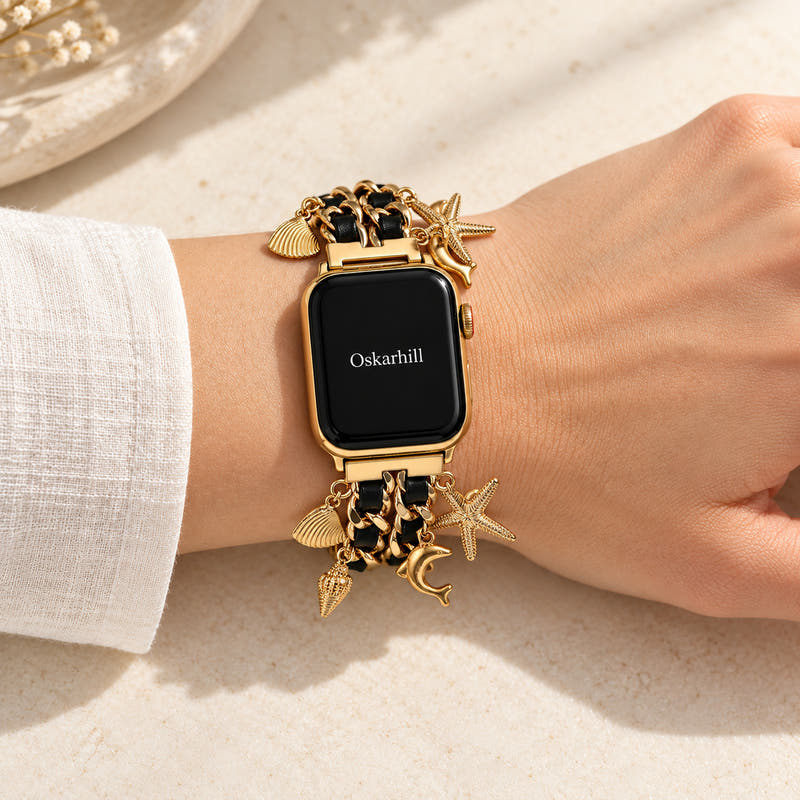 Oskar Hill Kaia Apple Watch charm band — on a feminine wrist with visible charm details
