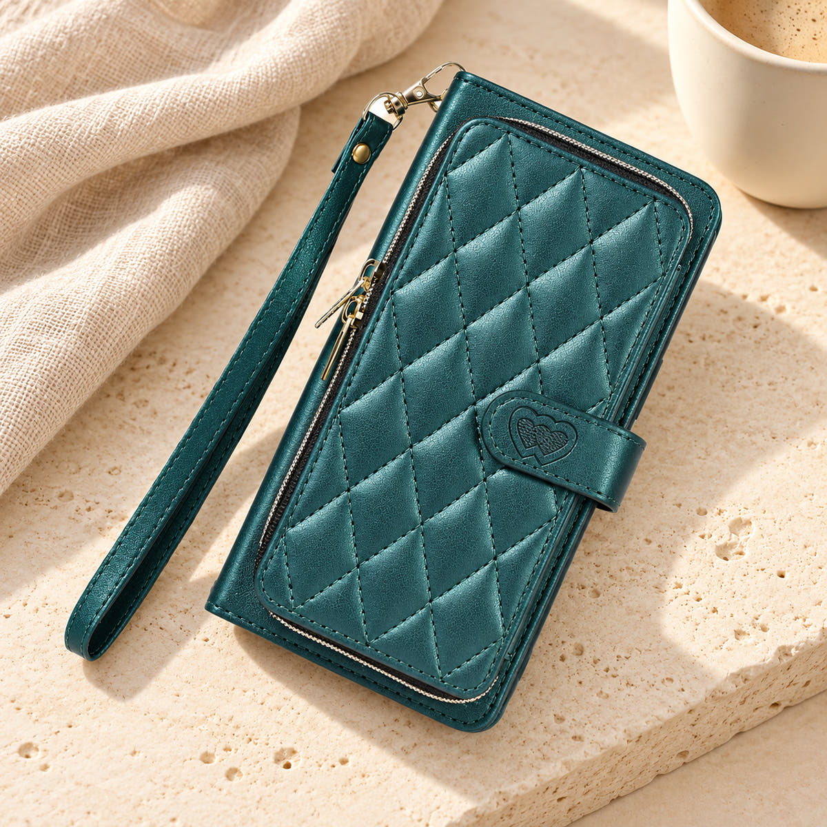 Forest Green padded zip wallet with wrist strap in a neutral tabletop setting