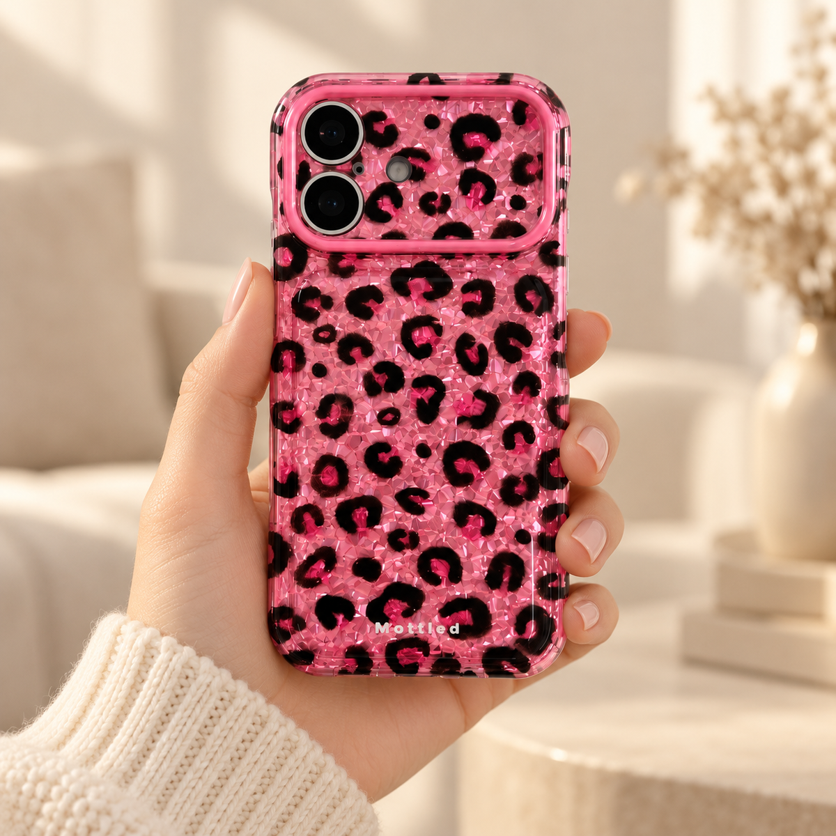 Glitter Leopard iPhone Case in Pink — handheld rear view