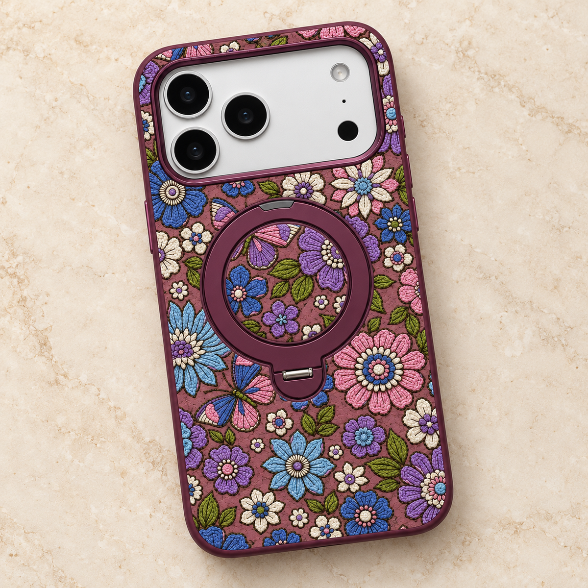 Plum Floral iPhone Case with Folding Ring Stand — diagonal flatlay with ring folded