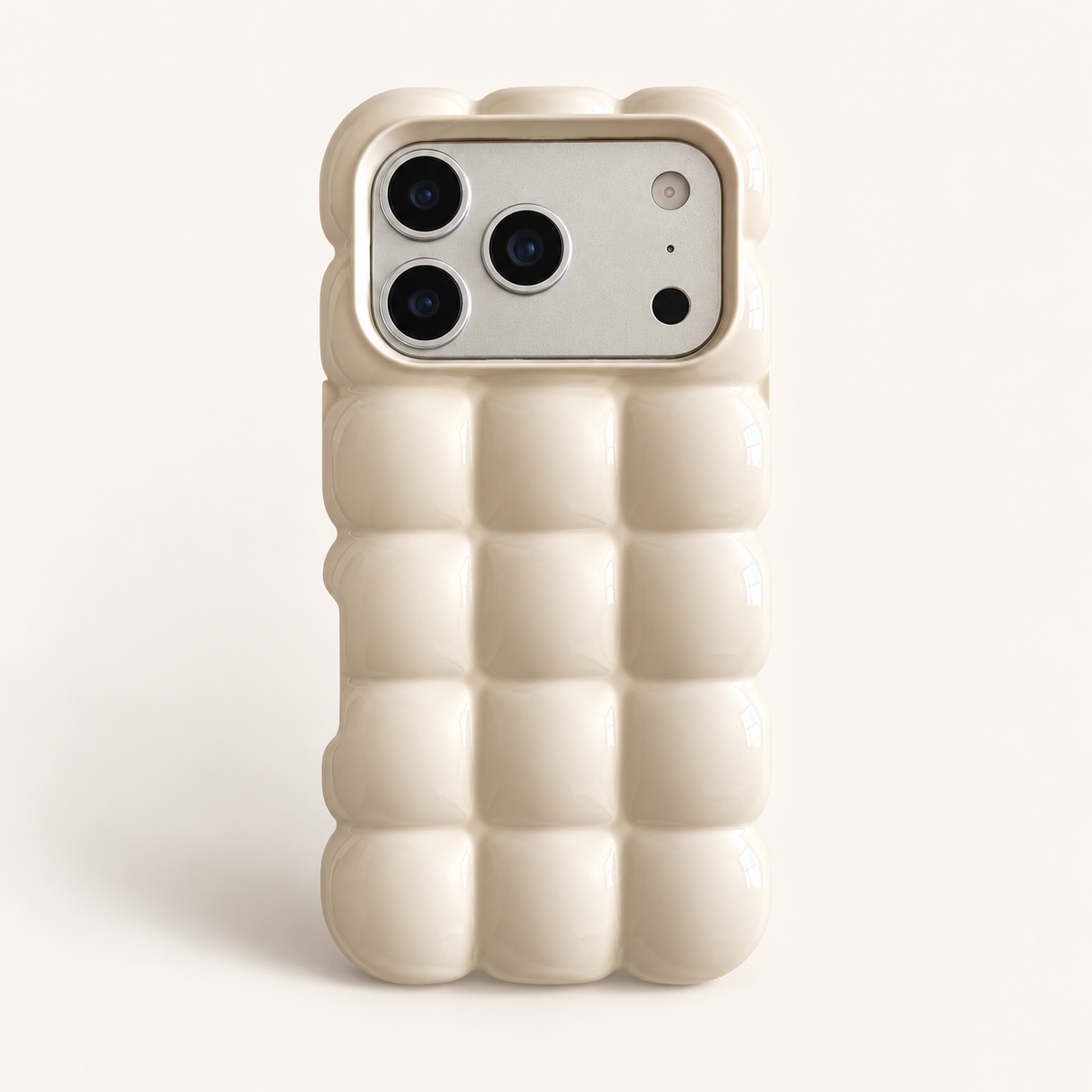 Cream puffy grid iPhone case with rounded-square back and scalloped edges — full rear studio view.