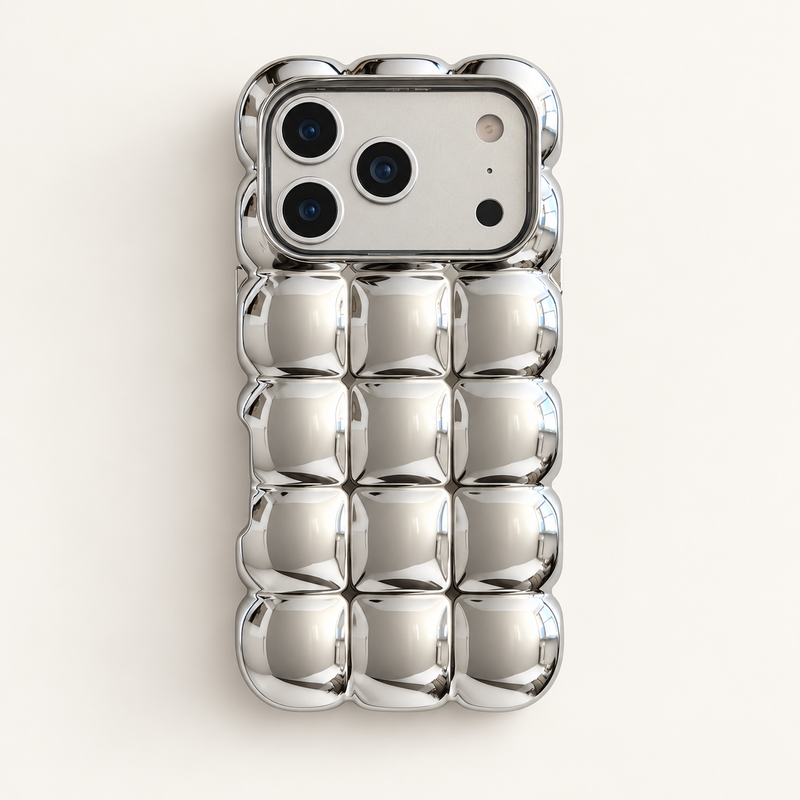 Mirror Silver puffy grid iPhone case with rounded-square back and scalloped edges — full rear studio view.