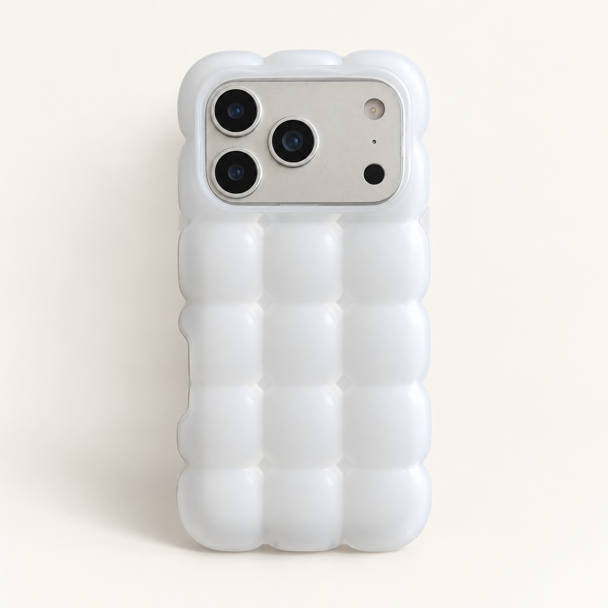White puffy grid iPhone case with rounded-square back and scalloped edges — full rear studio view.