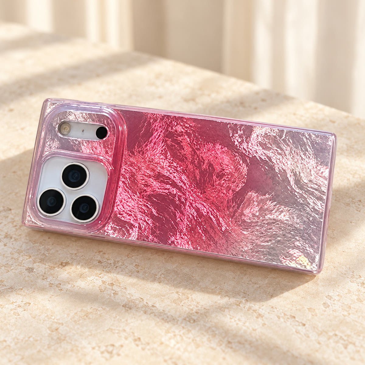 Landscape tabletop view of the Radiant Wave iPhone case with its camera surround at the left