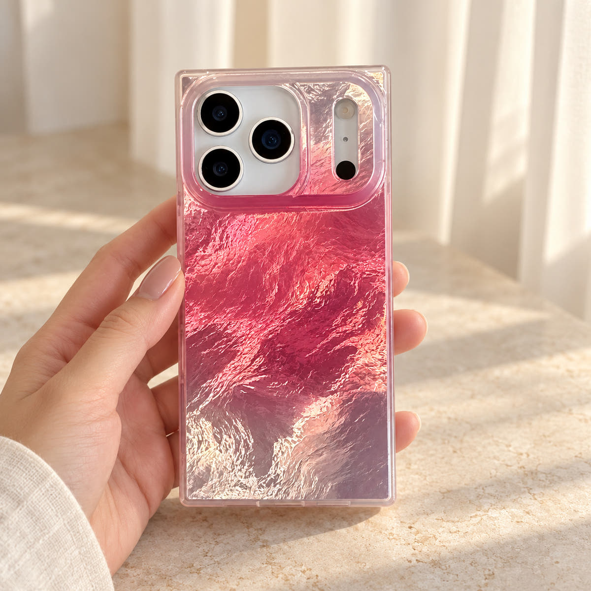 Radiant Wave pink iridescent case in a front-facing handheld rear view
