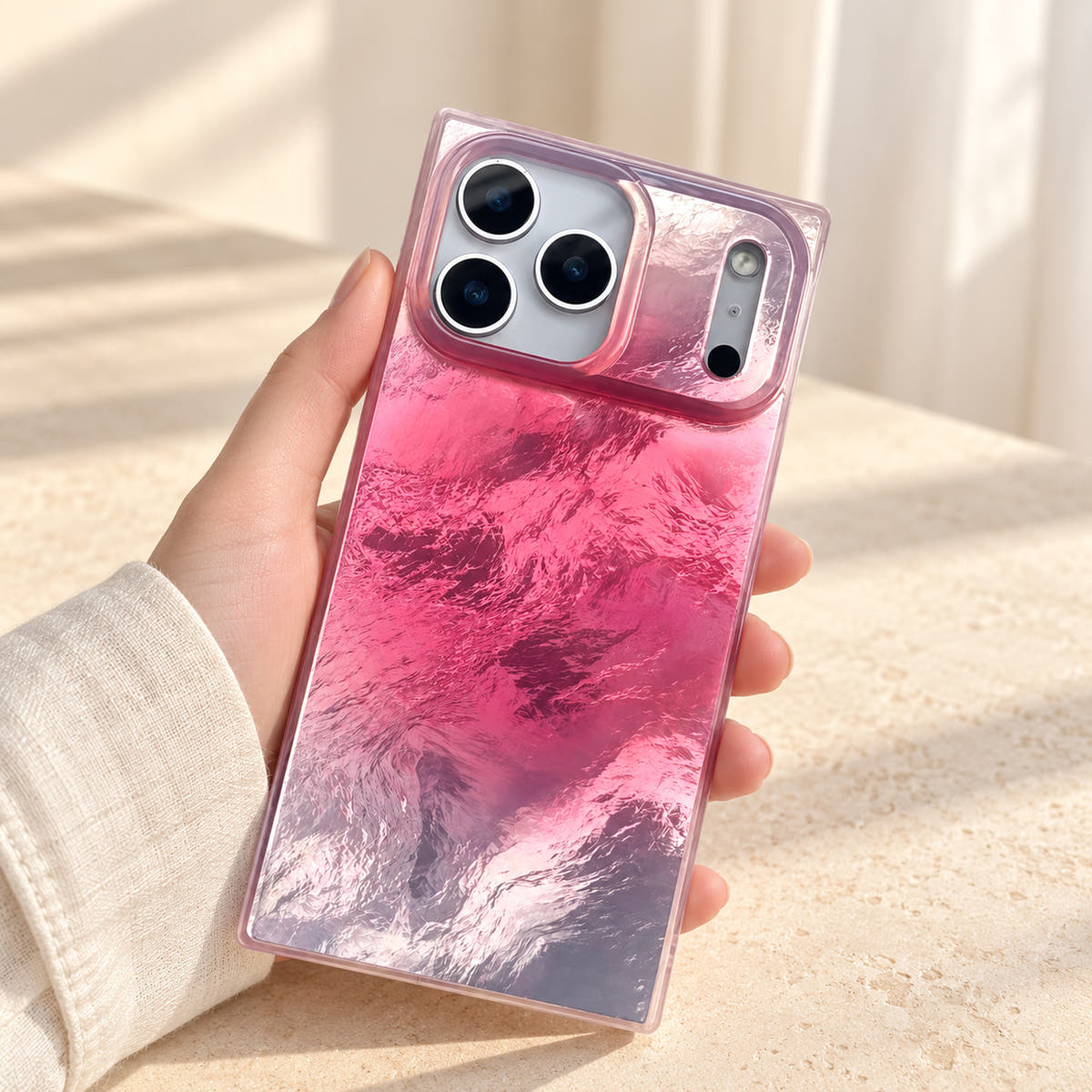 Radiant Wave iridescent iPhone case held in soft window light