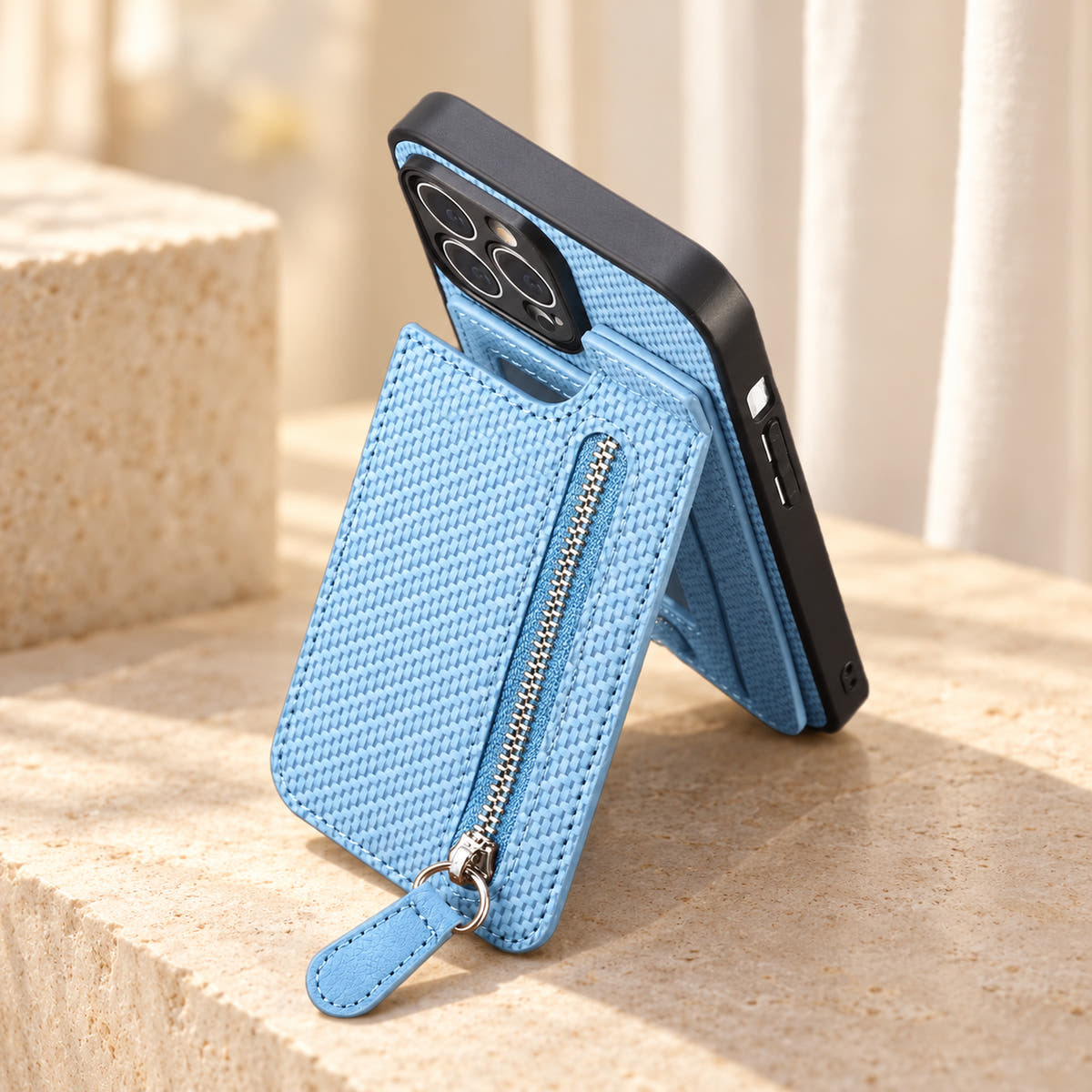 Signature Blue iPhone wallet case shown with its attached rear pocket panel folded outward.