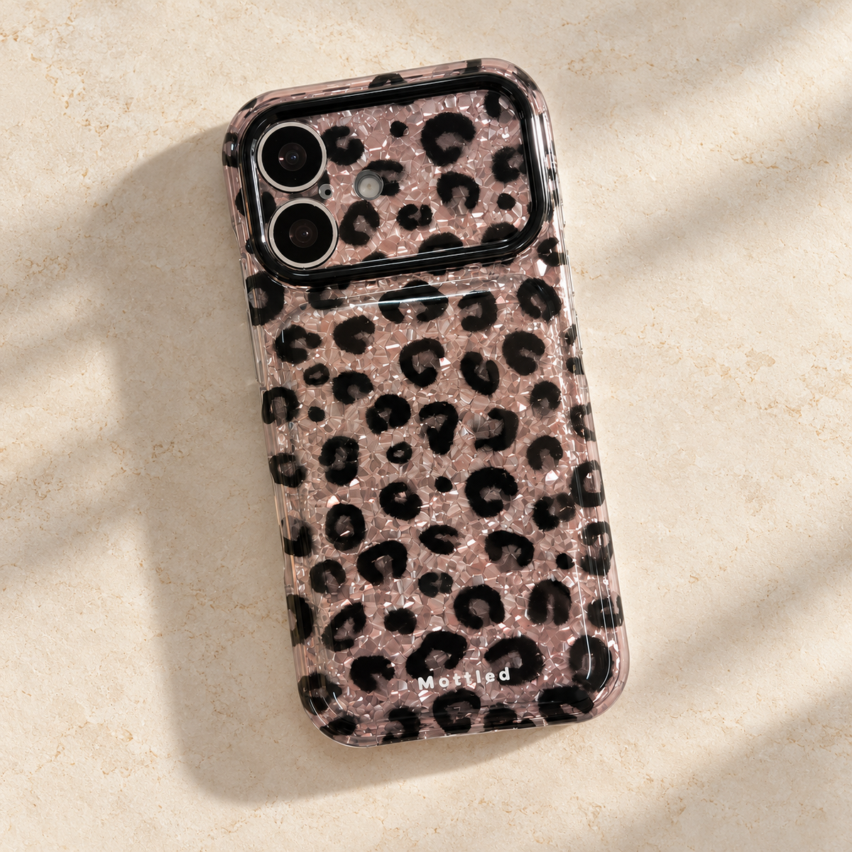 Glitter Leopard iPhone Case in Silver — diagonal rear flatlay
