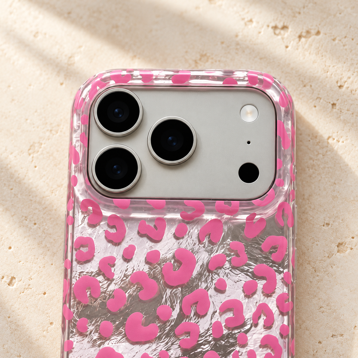 Close-up of the Pink leopard iPhone case camera opening and clear pink-patterned upper rim.