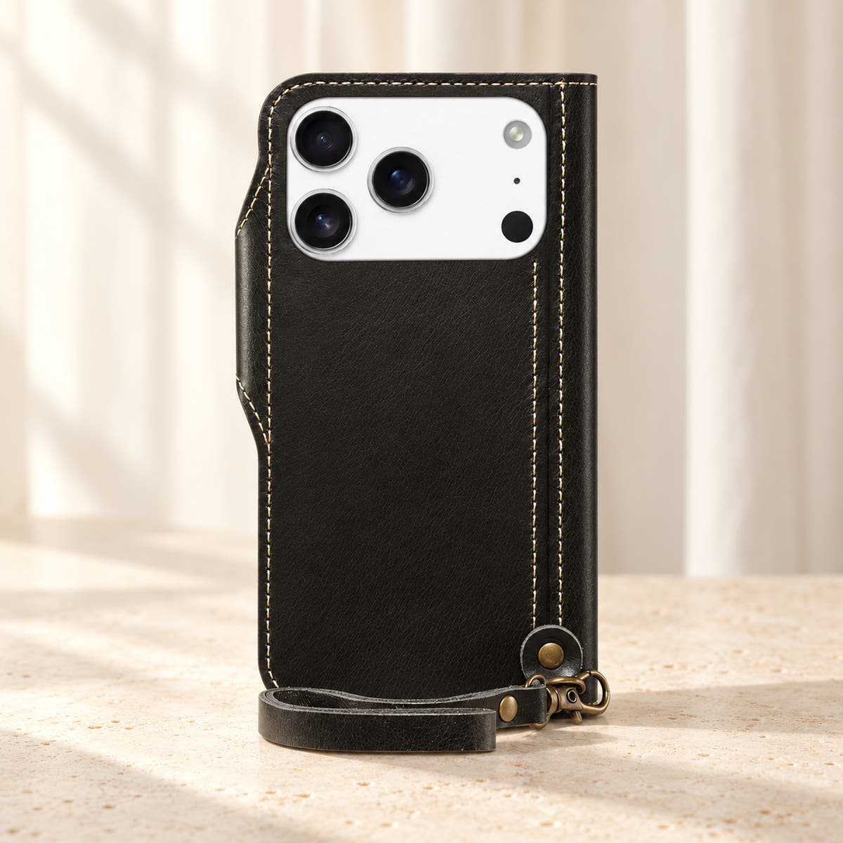 Black stitched wallet case rear view with the original camera opening and matching clip-on wrist loop