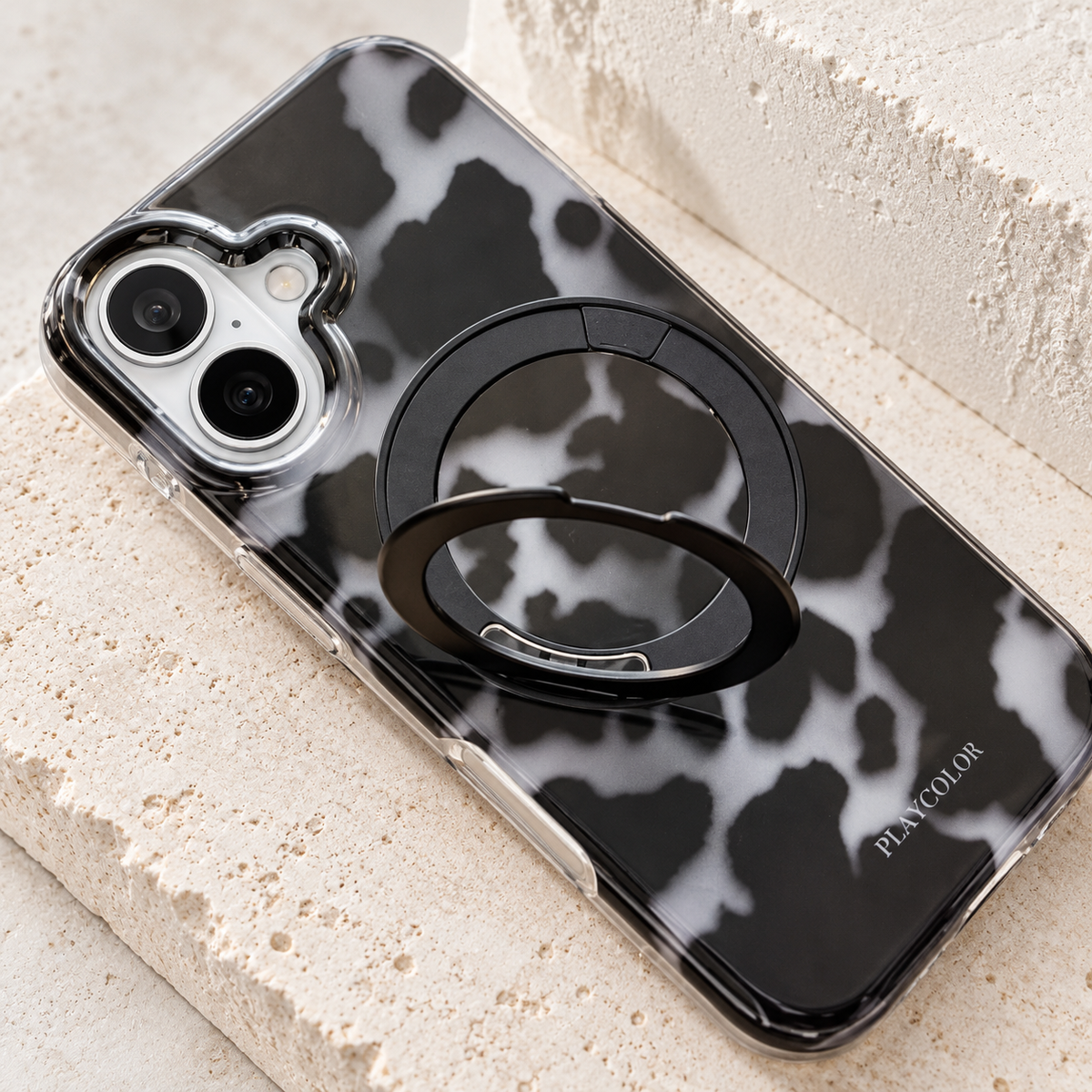 Close view of the Grey case's partially raised ring and attached hinge.