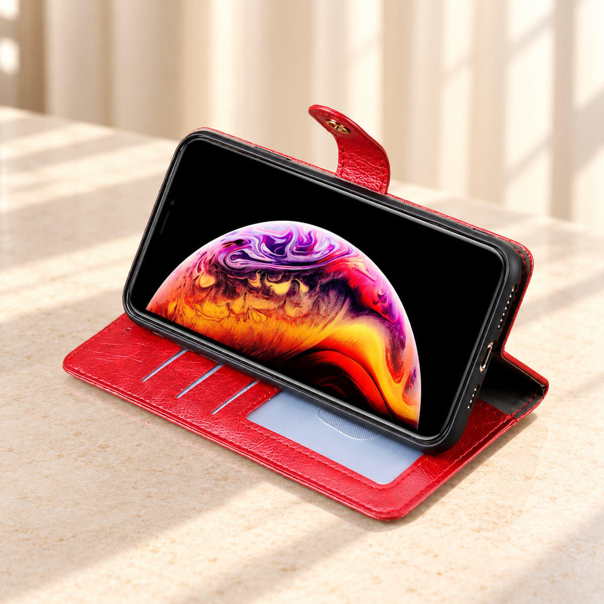 Valencia Luxe wallet phone case in Plum folded into a landscape viewing stand on a cream surface.