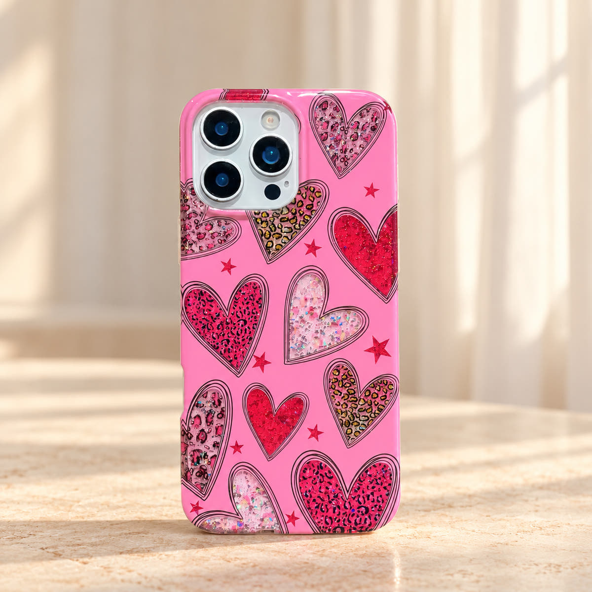 Straight rear view of the Valentina Sparkle Heart Pink iPhone case with red, pink and glitter-effect hearts.