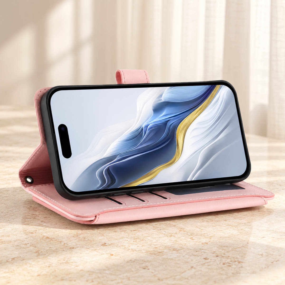 Velora Zip wallet case in Pink folded into a landscape viewing stand on cream limestone.