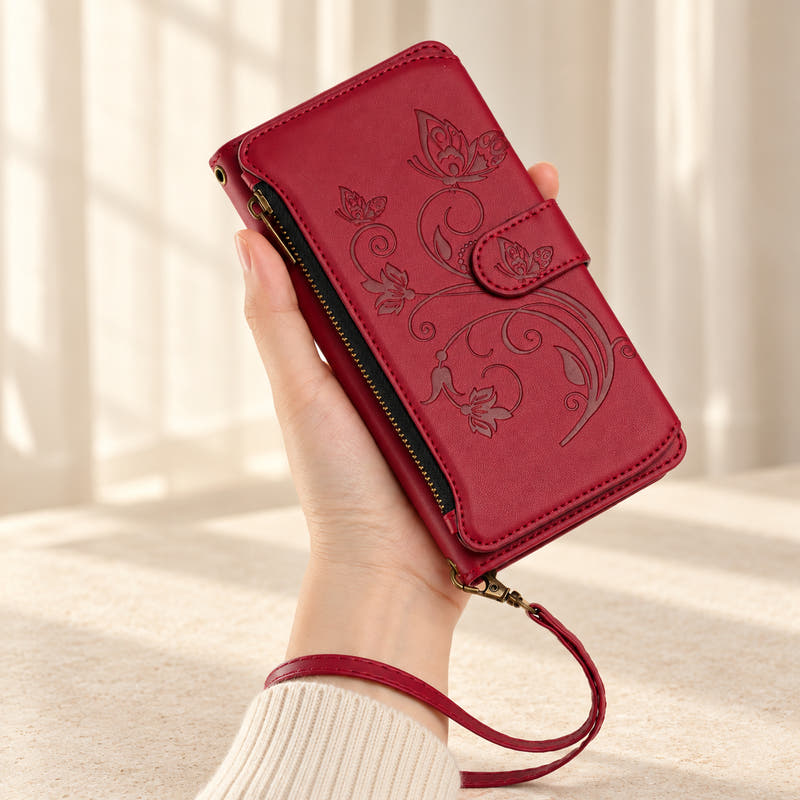 Velora Zip iPhone wallet case in Red, handheld with embossed butterfly front, side zip and matching wrist strap.