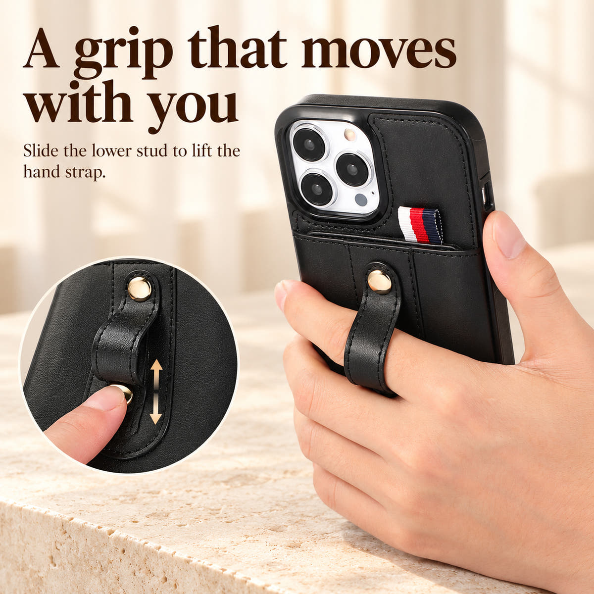 Black iPhone wallet case showing the adjustable hand grip and sliding gold-tone stud