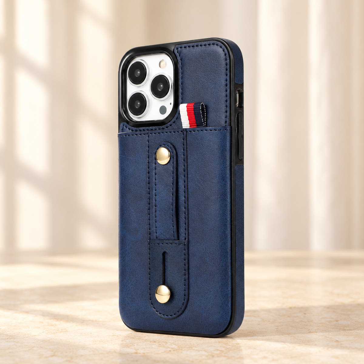 Navy Blue iPhone wallet case with card pocket and adjustable hand strap, hero